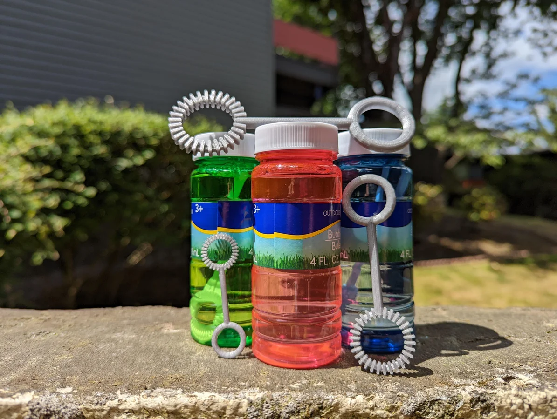Two 3D-printed bubble wands with ridged rings.