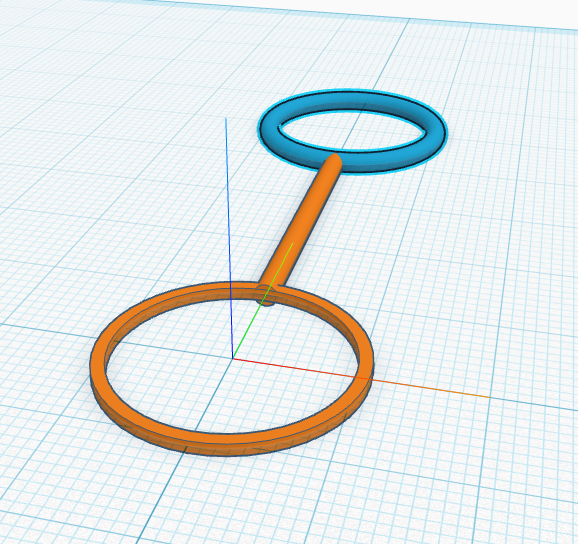 The torus at the far end of the handle.