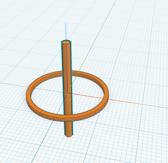 A tall thin cylinder standing up in the middle of the ring.