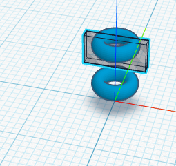 A translucent striped box standing through the upper ring.