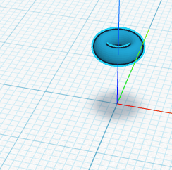 A single small ring floating above its shadow on the Workplane.
