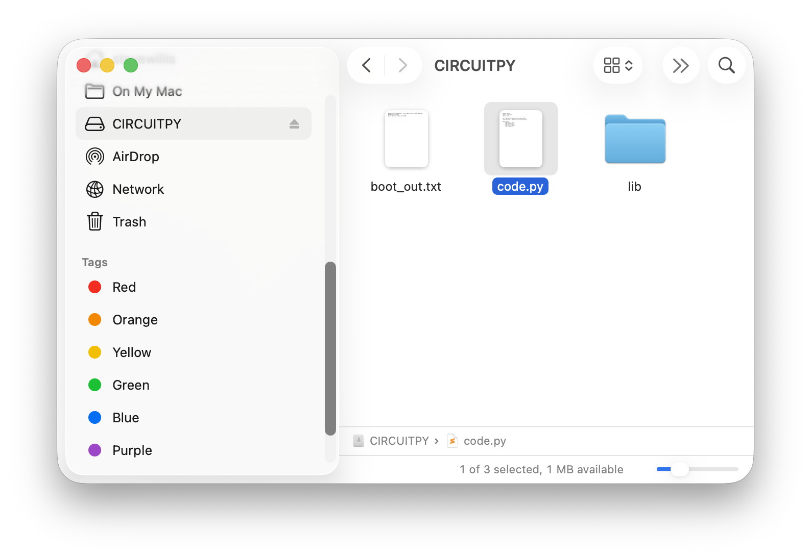 The CIRCUITPY drive in a file browser with code.py selected.