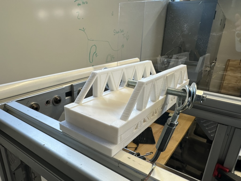 A truss bridge on the test rig, moments before science.